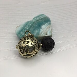 Ohm Aromatherapy Brass tone Locket.  Lava stone included.
